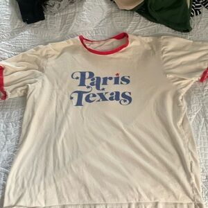 Ban. Do T-shirt says “Paris, TX” size medium